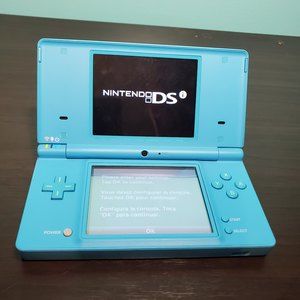 Nintendo DSi Light Blue Console Game System w/ Case & 8 Games, No Charger
